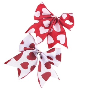 Nœuds décoratifs faits main rouge et blanc avec motifs de cœurs pour fêtes et cadeaux