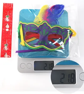 Carnival mask weighing 21.8g featuring purple green patterns and vibrant feathers