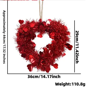 Detail view of red heart tinsel wreath with dimensions 44x36cm for festive decoration