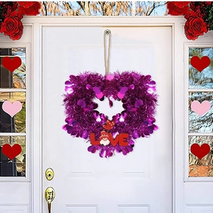 Purple heart wreath detail with LOVE sign and gnome for Valentine party door decor