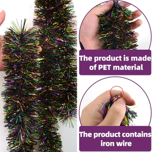 Macro detail of purple green gold PET tinsel garland with flexible iron wire core