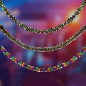 Close-up of purple, green, and gold glitter tinsel garlands for carnival party decoration