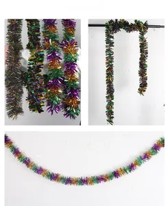 Detailed view of fluffy green, purple, and gold metallic tinsel garland for Mardi Gras decor