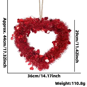 Red tinsel heart wreath with sequins and twine for Valentine's Day party decoration