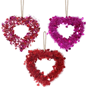 Three glitter heart wreaths in red, purple, and mixed colors for festive party decorations