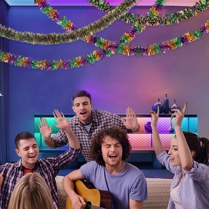 Festive purple, green, and gold metallic tinsel garland for party ceiling decoration