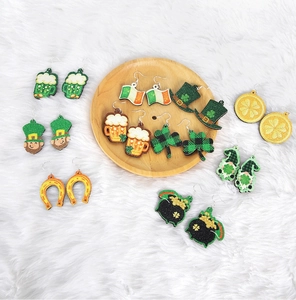 Detailed glittery festive earrings featuring beer mugs and shamrocks for St. Patrick's Day