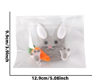 Detailed view of handmade grey felt bunny with carrot and dimensions for Easter hanging decor