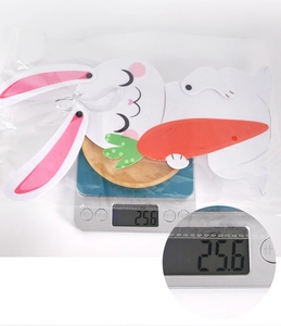 Detail showing Easter bunny wall hanging weight at 25.6g on a digital scale