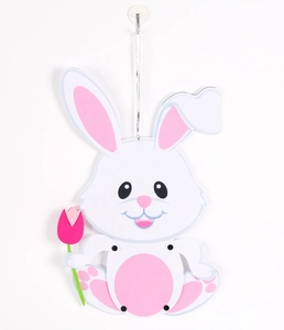 Detailed view of cartoon bunny ornament with pink tulip for Easter party decoration