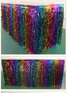 Detail of rainbow foil fringe table skirt with laser PET texture for party decorations