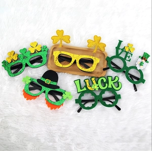 Detail view of five assorted St. Patrick's Day party glasses with shamrocks and glitter