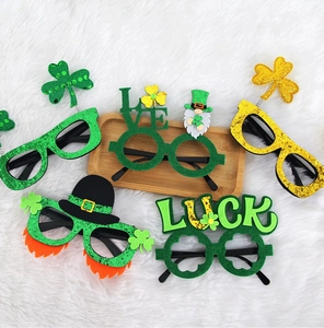 Close-up of Saint Patrick's Day shamrock and leprechaun hat party glasses set