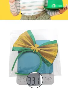Gewichtsmessung von 33,1 g für St. Patrick's Day Haarreif mit grün-goldener Schleife
