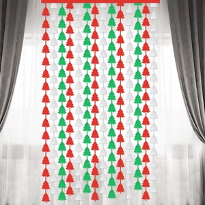 Close-up of red, green, and white Christmas tree fringe garland for festive home decoration