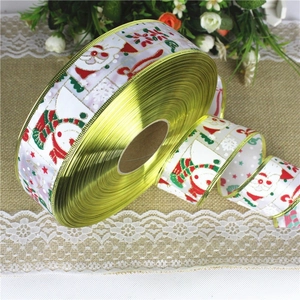 Detail of 2M Christmas ribbon with snowman print, gold edges and festive holiday patterns