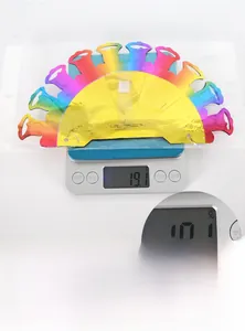 Rainbow gradient honeycomb party decoration detail showing weight of 19.1g on a scale