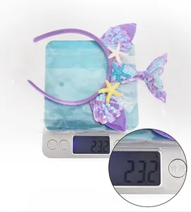 Detail shot showing 23.2g weight of mermaid headband with purple sequins and mesh