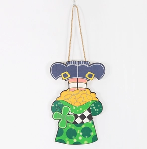 Detail of St. Patrick's Day wooden door sign with gnome legs, gold coins and lucky clover