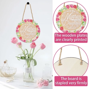 Detail of wooden Mother's Day plaque with floral print and rustic rope hanging