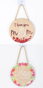 Detail of circular wooden Mother's Day plaques with floral motifs and jute ropes