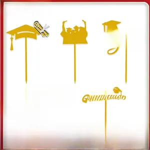 Five-piece set of gold acrylic graduation cake toppers featuring Dr. caps and celebratory silhouettes