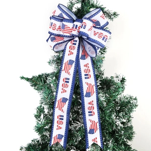 USA Independence Day bow decoration with stars and stripes on a green tree