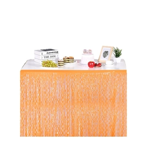 Neon orange wave tinsel table skirt for birthday parties and dessert table decoration