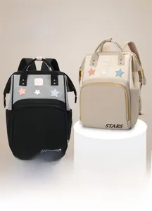 Detail view of baby bag showing large capacity, wide opening and waterproof fabric