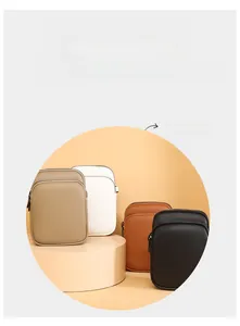 Detail of pebbled faux leather mini crossbody bags in four stylish neutral colors