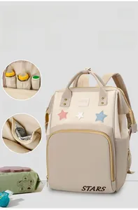 Detail of insulated aluminum foil bottle pocket and star embroidery on beige backpack