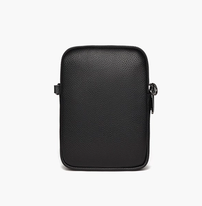 Detail of lychee textured black leather mini bag with dark grey metal buckle and zipper