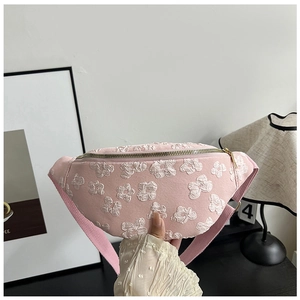 Pink saddle bag with white 3D flower embroidery and adjustable shoulder strap