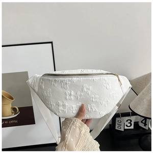 White embroidered saddle bag with floral jacquard texture and adjustable strap for women