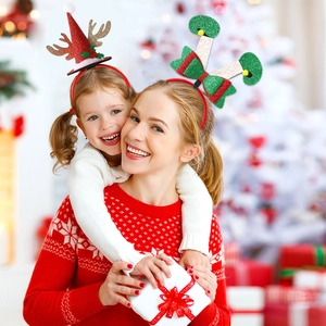Christmas headband set with glittery Santa hat and reindeer antlers worn by a model