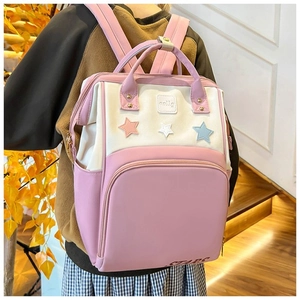 Detail view of the star pattern and durable waterproof fabric on the diaper backpack