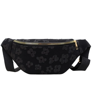 Floral embroidered black saddle bag with golden zippers and adjustable shoulder strap
