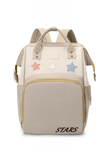 Close-up of stylish water-resistant diaper backpack with stars patch and STARS logo