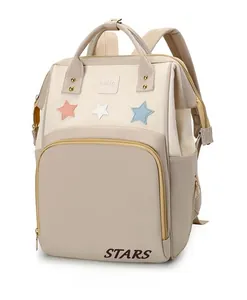 Beige multi-pocket diaper backpack featuring star embroidery and waterproof material