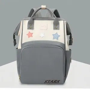 Gray mommy backpack with star patterns and water-resistant fabric for baby care storage