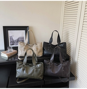 Modern soft leather tote bags in four colors displayed with a vintage lifestyle backdrop