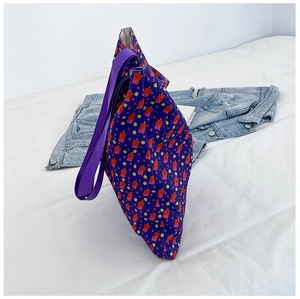 Detailed view of purple floral canvas tote with ice cream print and wide shoulder strap