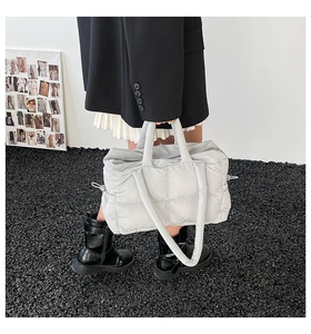Modern light gray quilted puffer tote bag with spacious interior and padded top handles
