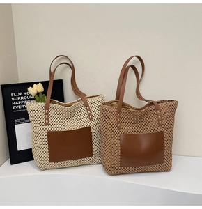 Close-up of woven tote bag with PU leather handles and reinforced cross stitching