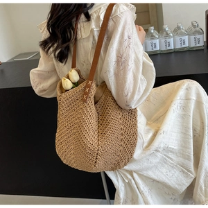 Detailed texture of cotton crochet knit tote with premium leather handle and stitching