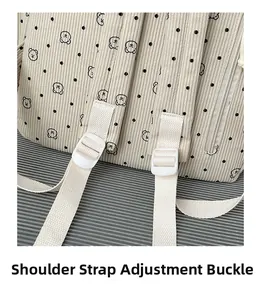 Detail of adjustable strap with bear and polka dot print on corduroy backpack