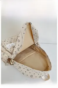 Internal view of the cream corduroy backpack with cute bear print and large main compartment