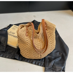 Minimalist hand-woven cotton beach tote bag with brown leather handles and vintage stitching