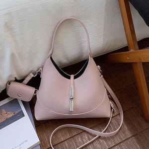 Pink lychee leather hobo bag with silver piston clasp and matching mini coin purse