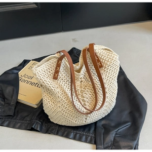 Beige cotton woven tote bag with brown leather straps and large capacity for beach travel